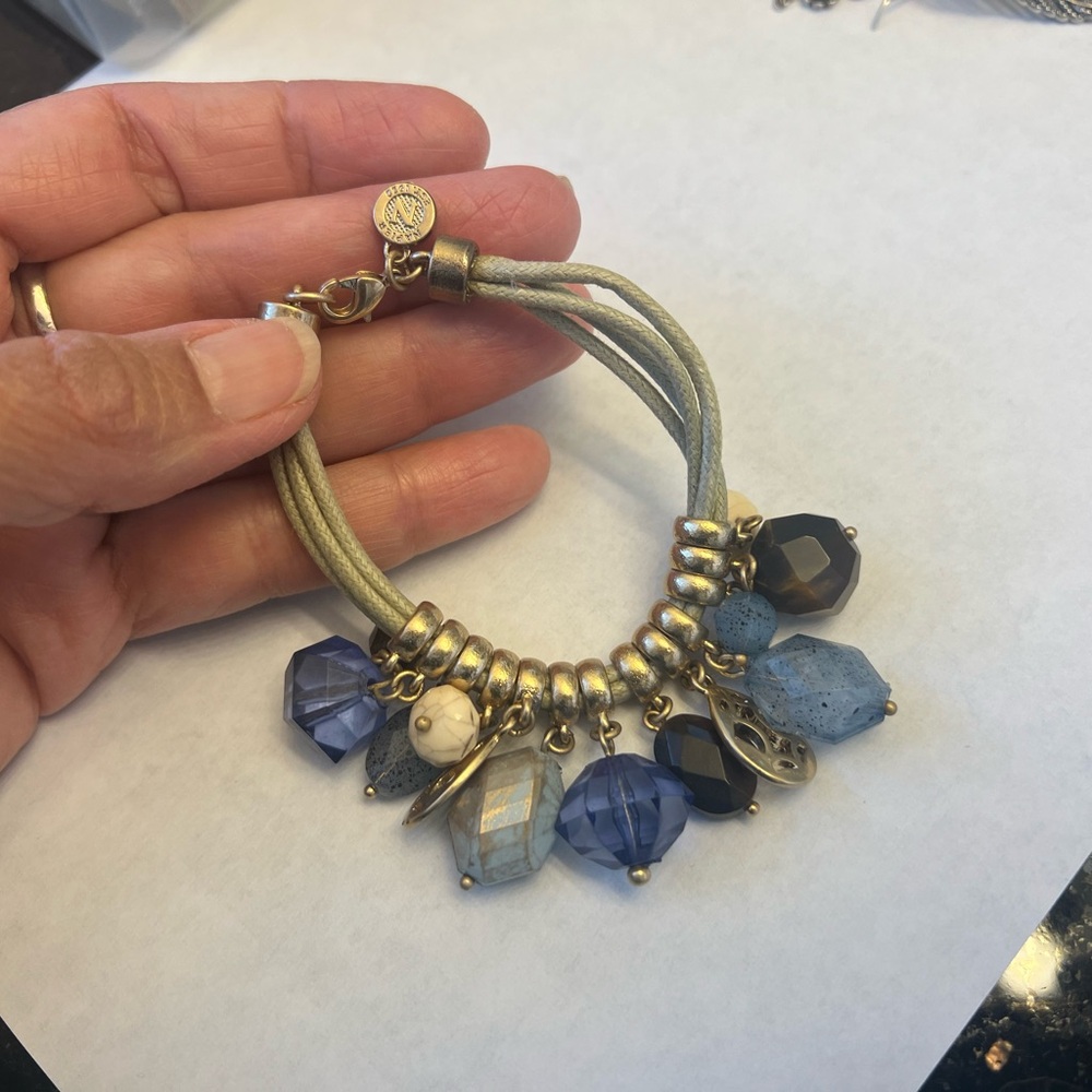 NAPIER gold tone bracelet with blue tone glass beads and stones